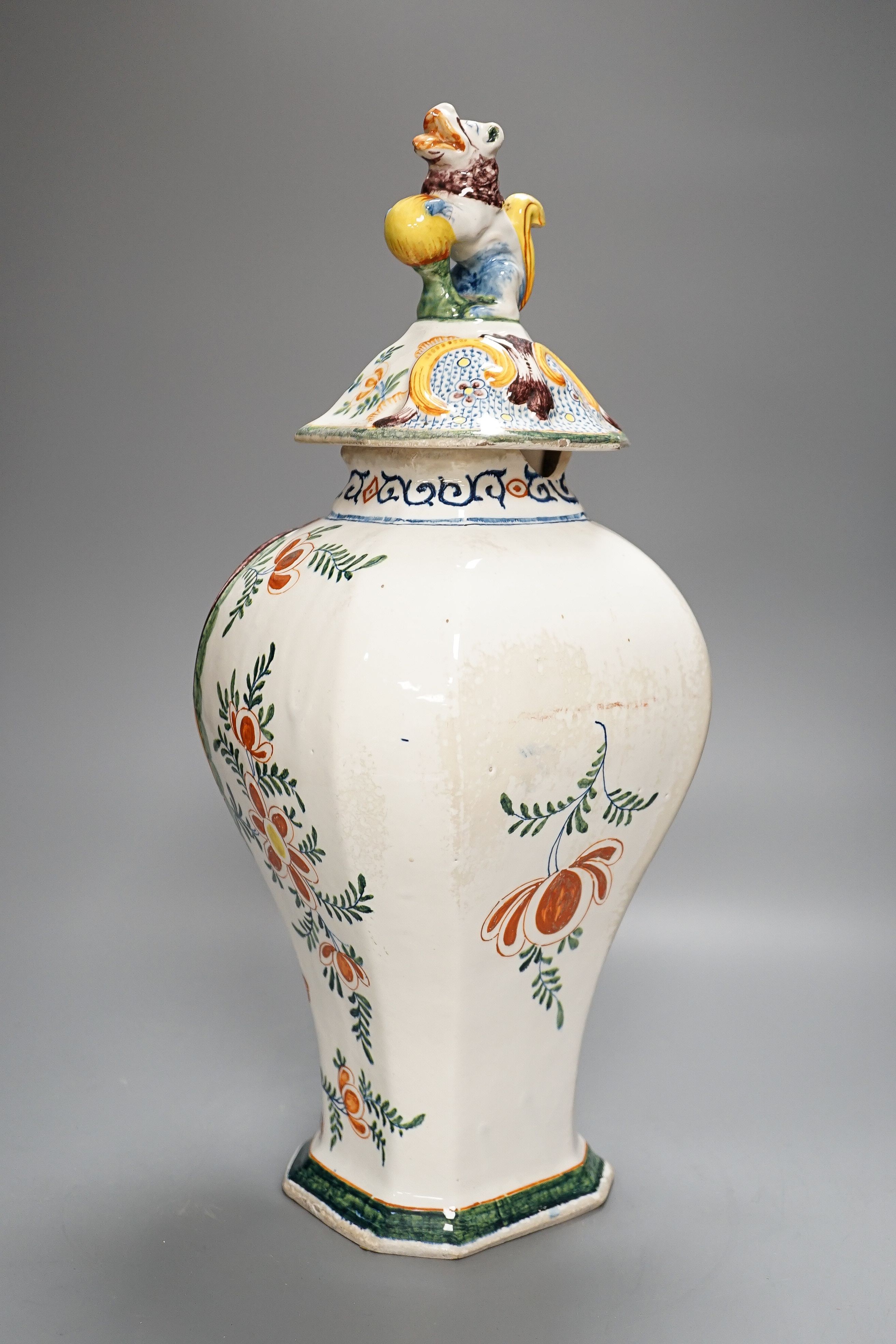 A large 19th century Delft polychrome vase and cover, 46cm, some damage